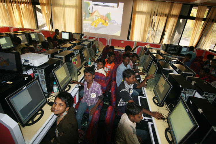 Tribal-children-enjoying-Paint-brush-on-the-Computer